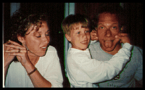 With his wife and son, 1997
