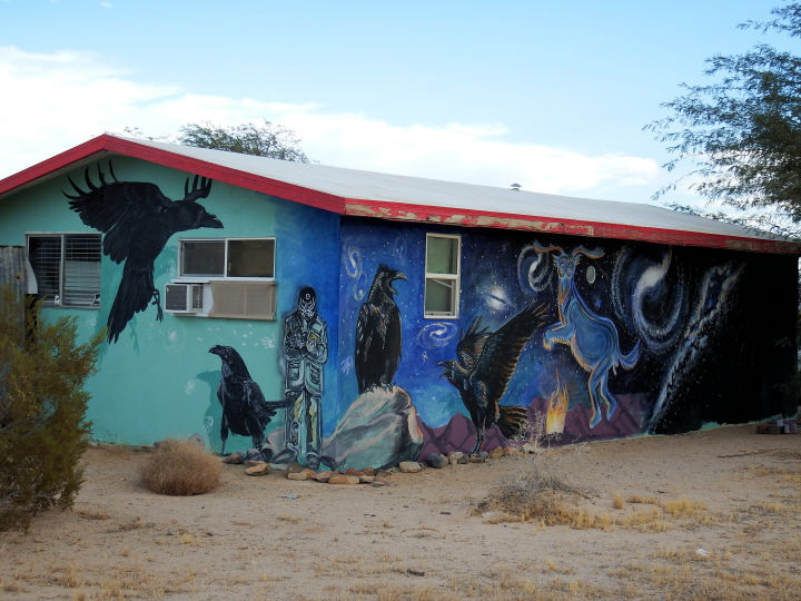These murals on Dave's house face the road.