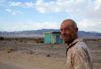 Dave and a Homesteader Cabin on the property.